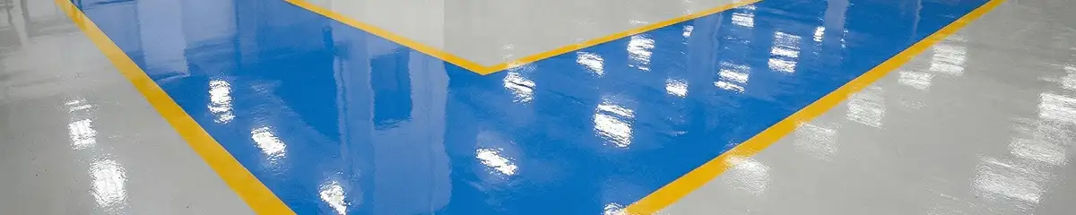 A factory floor professionally covered and marked with epoxy flooring in Charlotte, NC