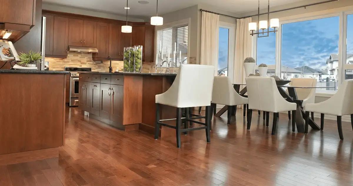 A modern kitchen with professionally installed wood flooring in Charlotte, NC