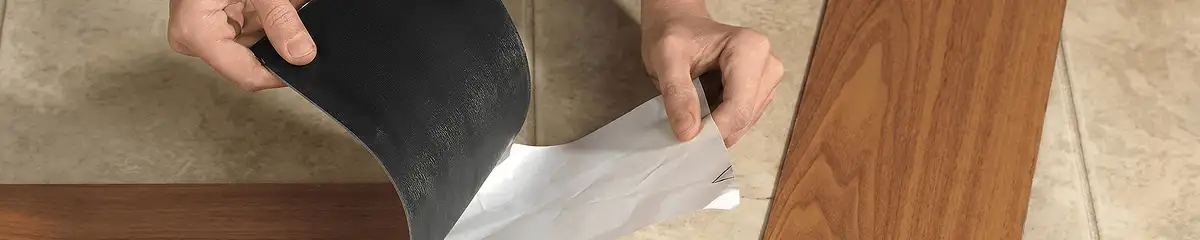 A professional installing vinyl flooring in Charlotte, NC
